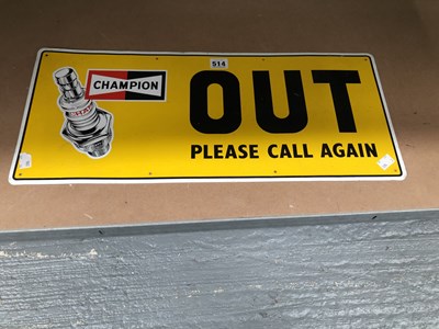Lot 514 - A yellow ground enamel Champion spark plug...