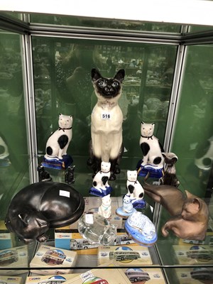 Lot 516 - A collection of cat figurines to include two...