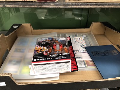 Lot 520 - Pokemon cards, a players guide together with a...