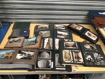 Lot 529 - A collection of postcards in ten albums