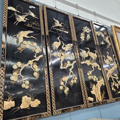 Lot 99 - Four oriental lacquered panels decorated with...