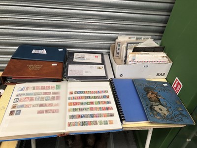 Lot 531 - Thee albums of world postage stamps, albums of...