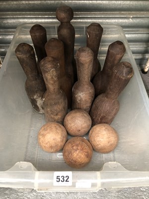 Lot 532 - Nine wooden skittles together with four balls