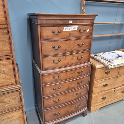 Lot 104 - A small 20th century yew veneer chest on chest...