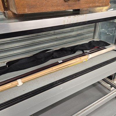 Lot 559 - Two wooden kendo swords