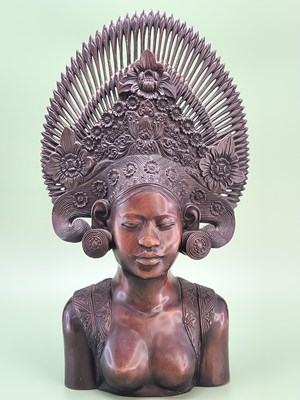 Lot 1715 - A finely carved Indonesian hardwood figure of...