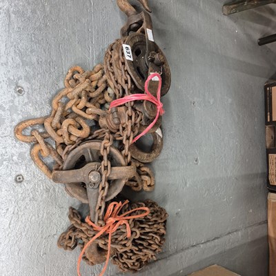 Lot 637 - A system of iron chains and pulleys