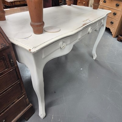 Lot 132 - A white painted mahogany serpentine writing...