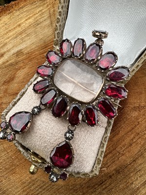 Lot 1170 - A 19th century garnet and diamond pendant...