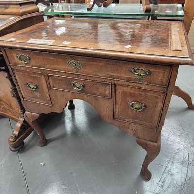 Lot 142 - A Georgian walnut lowboy with burr inlayed top...