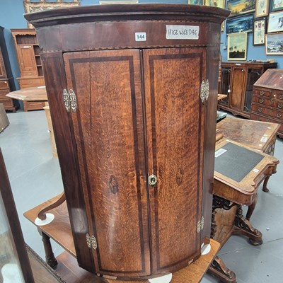 Lot 144 - A 19th century inlaid oak bow front corner...