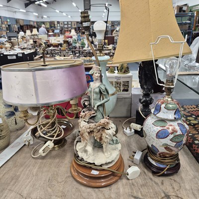Lot 665 - A Lady with two dogs table lamp together with...