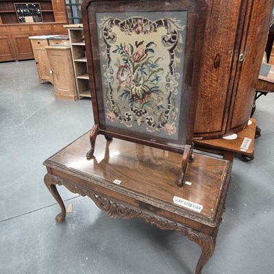 Lot 145 - A 20th century carved coffee table with glass...