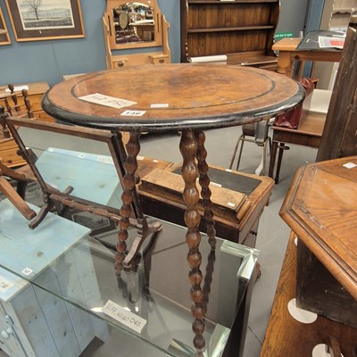 Lot 146 - A burr wood round occasional table on three...