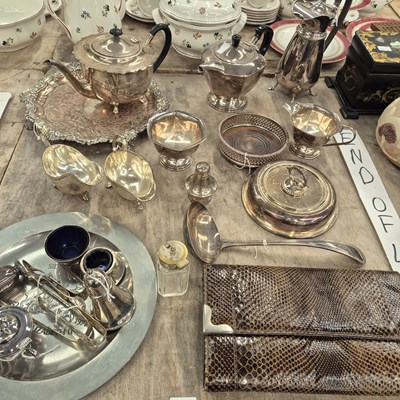 Lot 674 - An electroplate three piece tea set, sauce...