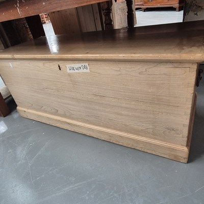 Lot 152 - A large antique pine blanket box with candle...