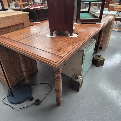 Lot 156 - A hardwood kitchen/dining table on turned legs...