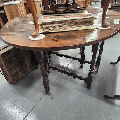 Lot 163 - A 19th century fruitwood top gateleg table on...