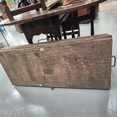 Lot 164 - An antique tin uniform trunk with a brass...
