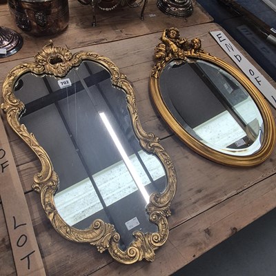 Lot 702 - A gilt framed oval mirror together with...