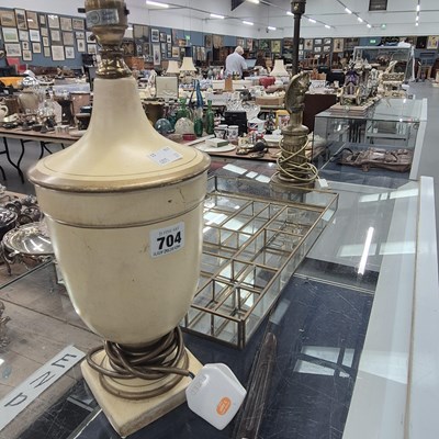 Lot 704 - A brass and a cream painted urn shaped table...