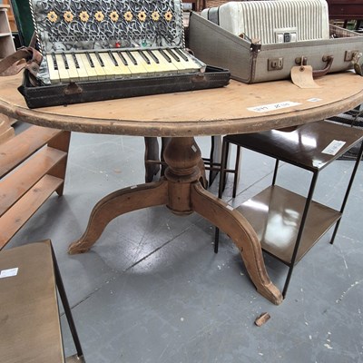Lot 167 - A vintage round pine table on a tripod...