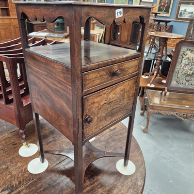 Lot 170 - A 19th century mahogany washstand, the shaped...