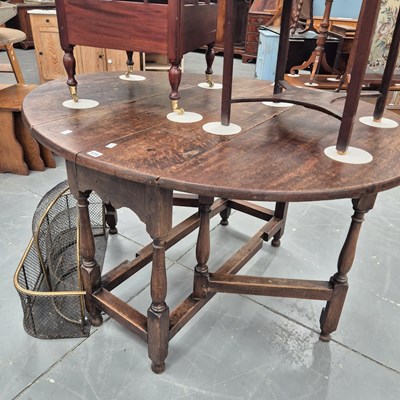 Lot 171 - A 19th century oak gateleg supper table on...