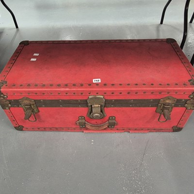 Lot 742 - A red travel trunk