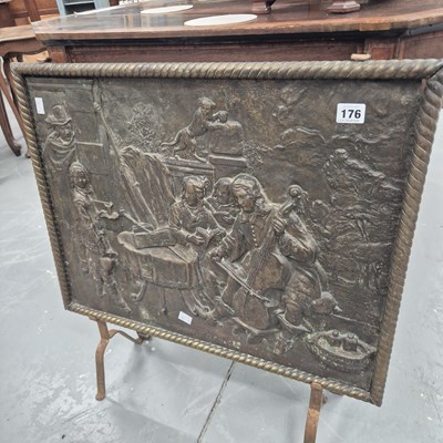 Lot 176 - A decorative pressed metal fire guard