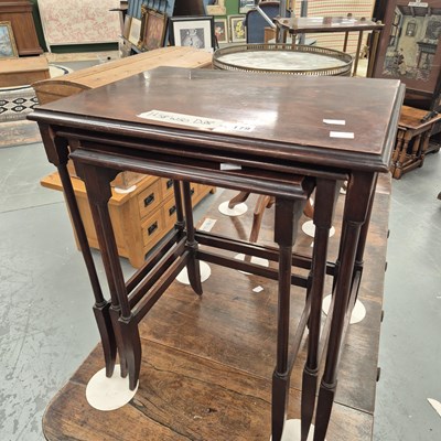 Lot 179 - An Edwardian mahogany nest of three tables on...