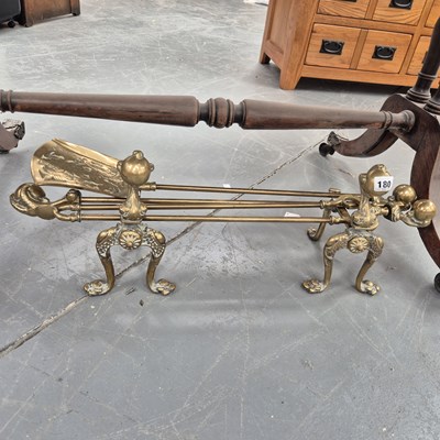 Lot 180 - A set of Victorian brass andirons and fire...