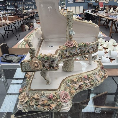 Lot 771 - A flower encrusted porcelain piano and stand...