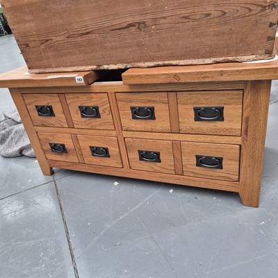 Lot 182 - An oak coffee table, the top drawing to revel...