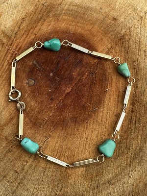 Lot 1168 - An antique turquoise-set bracelet, the four...
