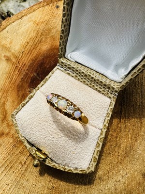 Lot 1033 - A Victorian opal and diamond five-stone ring,...