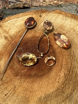 Lot 1103 - A 9ct gold citrine brooch with a steel pin,...