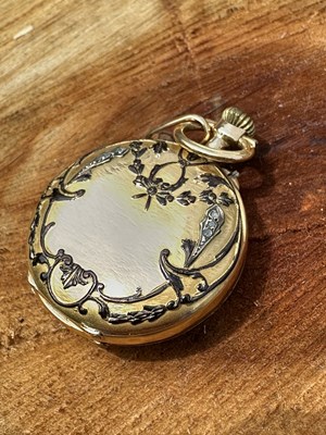 Lot 1210 - An antique gold fob watch with white enamel...
