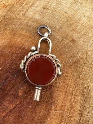 Lot 1214 - An antique watch key fob, the rotating mount...