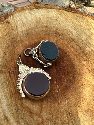 Lot 1216 - Two antique rotating seal fobs, each mounted...