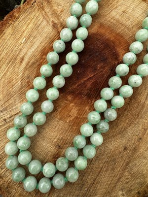 Lot 1226 - A modern jade bead necklace composed of...