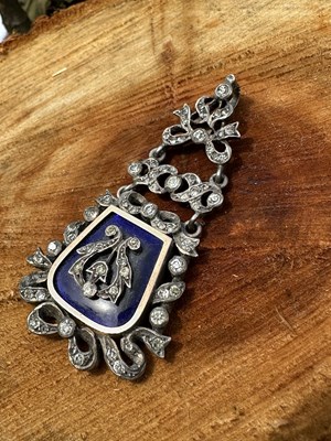 Lot 1233 - A Victorian articulated pendant, unhallmarked,...