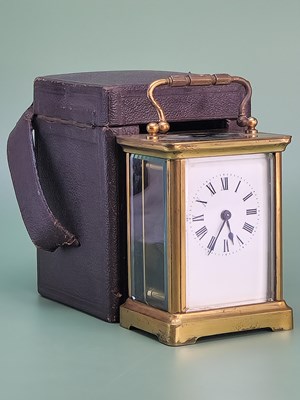 Lot 1535 - A leather cased carriage timepiece, stamped...