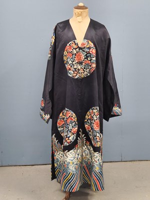 Lot 1539 - An antique Chinese black silk robe embroidered...