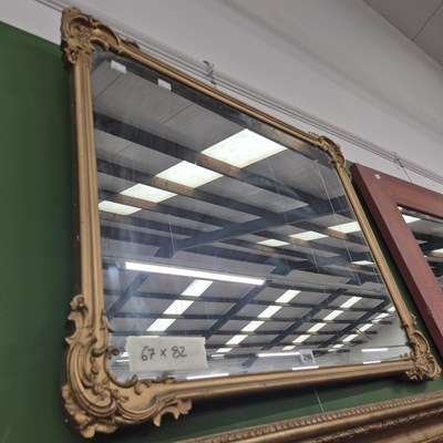 Lot 296 - A gilt framed mirror with ornate corner...