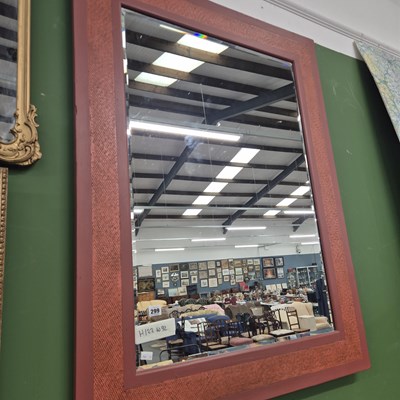 Lot 299 - A modern mirror in a painted and textile inset...