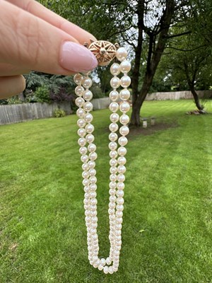 Lot 1241 - Two-row cultured pearl necklace, the pearls...
