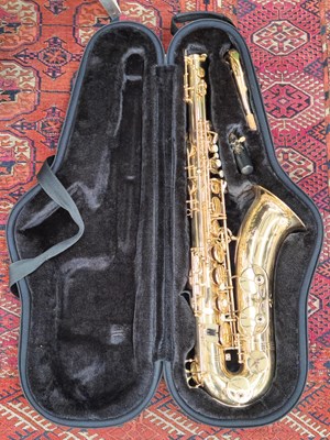 Lot 1806 - An Antigua brass saxophone in a padded carry...
