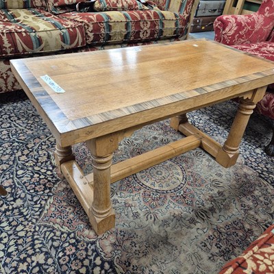 Lot 315 - A bespoke oak crossbanded coffee table on...