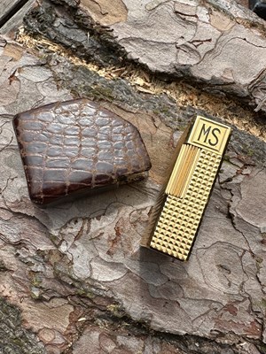 Lot 1256 - An S.T. Dupont Paris 18ct gold-plated lighter,...